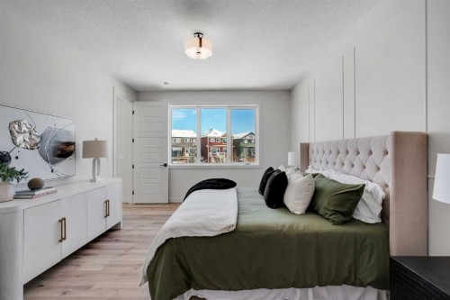 88 Sunrise Heath, Cochrane, AB - Indoor Photo Showing Bedroom