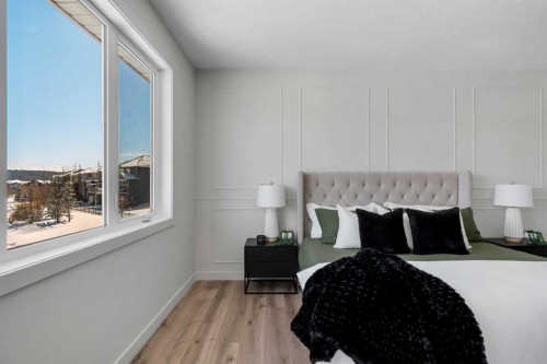88 Sunrise Heath, Cochrane, AB - Indoor Photo Showing Bedroom