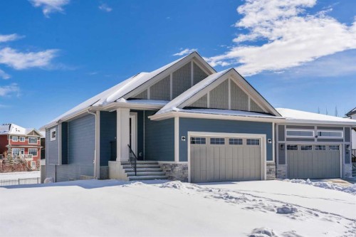 88 Sunrise Heath, Cochrane, AB - Outdoor With Facade