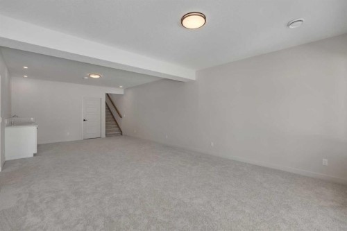 88 Sunrise Heath, Cochrane, AB - Indoor Photo Showing Other Room