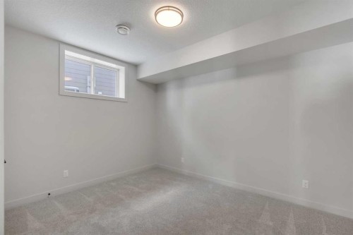 88 Sunrise Heath, Cochrane, AB - Indoor Photo Showing Other Room