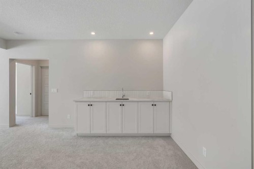 88 Sunrise Heath, Cochrane, AB - Indoor Photo Showing Other Room