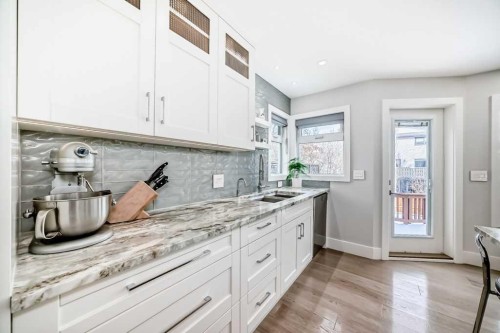 256 Riverside Mews Se, Calgary, AB - Indoor Photo Showing Kitchen With Upgraded Kitchen