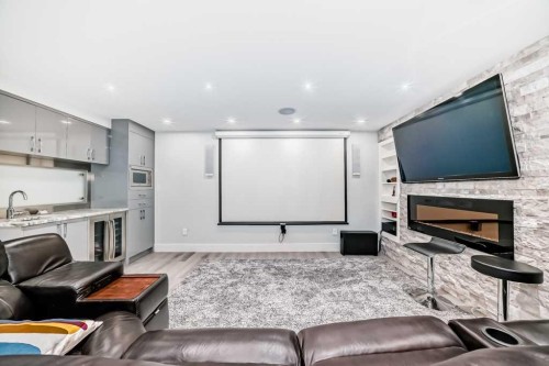 256 Riverside Mews Se, Calgary, AB - Indoor Photo Showing Other Room With Fireplace