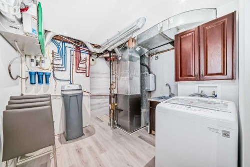 256 Riverside Mews Se, Calgary, AB - Indoor Photo Showing Laundry Room