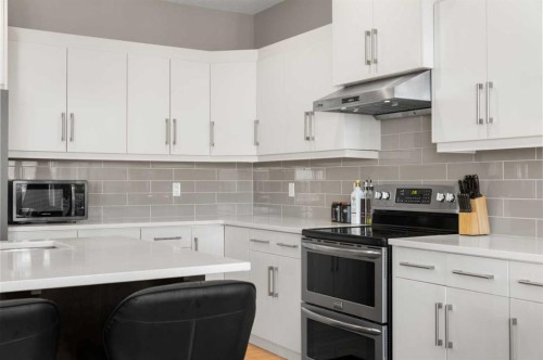 151 Heritage View, Cochrane, AB - Indoor Photo Showing Kitchen With Upgraded Kitchen
