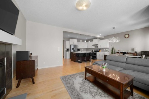 151 Heritage View, Cochrane, AB - Indoor Photo Showing Living Room With Fireplace