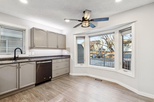 172 Riverglen Park Se, Calgary, AB - Indoor Photo Showing Kitchen With Double Sink