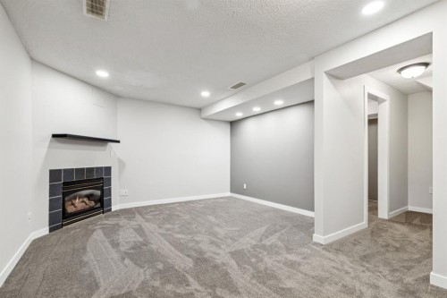 172 Riverglen Park Se, Calgary, AB - Indoor Photo Showing Other Room With Fireplace