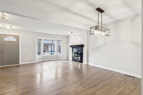 172 Riverglen Park Se, Calgary, AB - Indoor Photo Showing Living Room With Fireplace