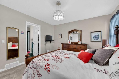 155 Morningside Circle Sw, Airdrie, AB - Indoor Photo Showing Bedroom