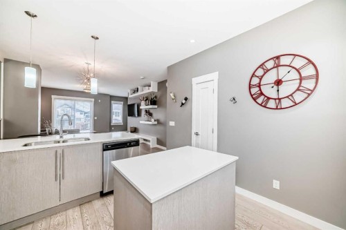 53-111 Rainbow Falls, Chestermere, AB - Indoor Photo Showing Kitchen With Double Sink