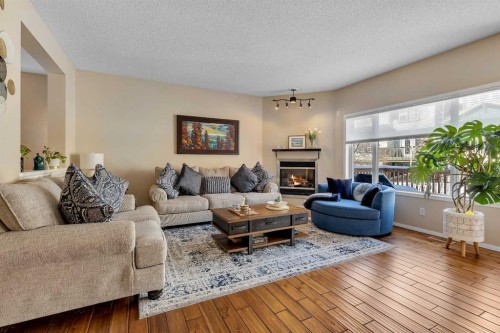 10 Evansbrooke Place Nw, Calgary, AB - Indoor Photo Showing Living Room With Fireplace