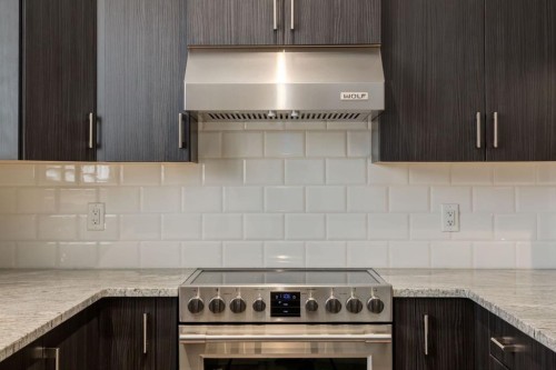 28 Masters Link Se, Calgary, AB - Indoor Photo Showing Kitchen With Stainless Steel Kitchen With Upgraded Kitchen