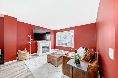 223 Auburn Bay Heights Se, Calgary, AB - Indoor Photo Showing Living Room With Fireplace