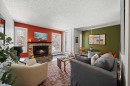 202-825 4 Street Ne, Calgary, AB  - Indoor Photo Showing Living Room With Fireplace 