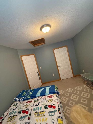 5107 42 Street, Olds, AB - Indoor Photo Showing Bedroom