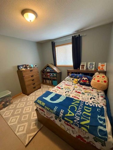 5107 42 Street, Olds, AB - Indoor Photo Showing Bedroom