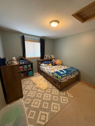 5107 42 Street, Olds, AB - Indoor Photo Showing Bedroom