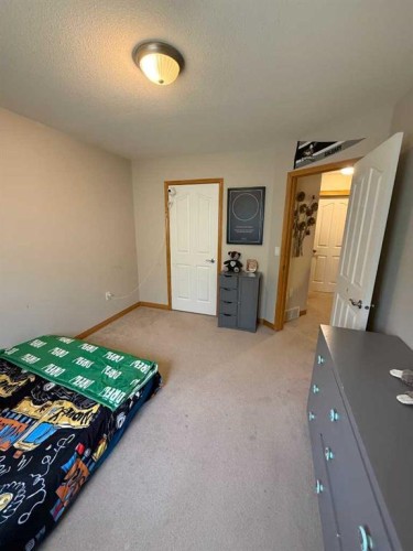 5107 42 Street, Olds, AB - Indoor Photo Showing Bedroom