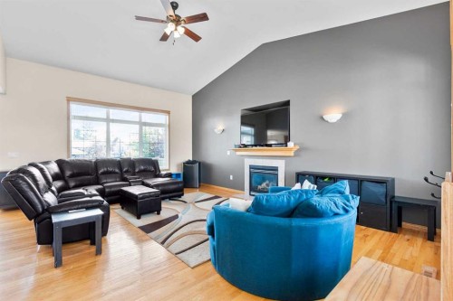 5107 42 Street, Olds, AB - Indoor Photo Showing Living Room With Fireplace