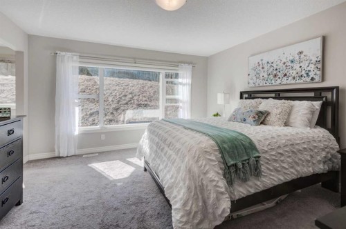 255 Riviera Way, Cochrane, AB - Indoor Photo Showing Bedroom
