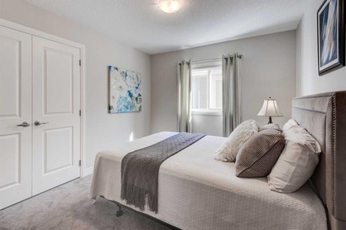 255 Riviera Way, Cochrane, AB - Indoor Photo Showing Bedroom