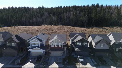 255 Riviera Way, Cochrane, AB - Outdoor With Facade