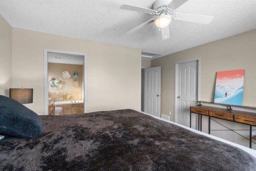 46 River Heights Boulevard, Cochrane, AB - Indoor Photo Showing Bedroom