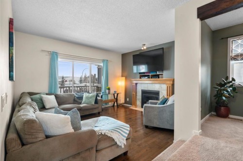 46 River Heights Boulevard, Cochrane, AB - Indoor Photo Showing Living Room With Fireplace