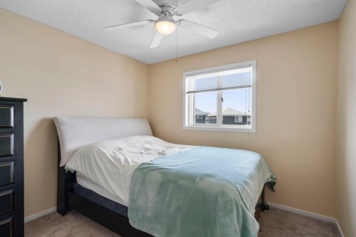 46 River Heights Boulevard, Cochrane, AB - Indoor Photo Showing Bedroom