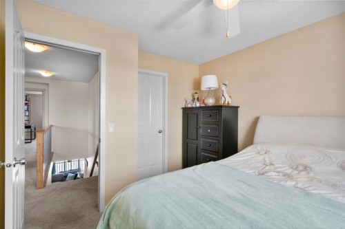 46 River Heights Boulevard, Cochrane, AB - Indoor Photo Showing Bedroom