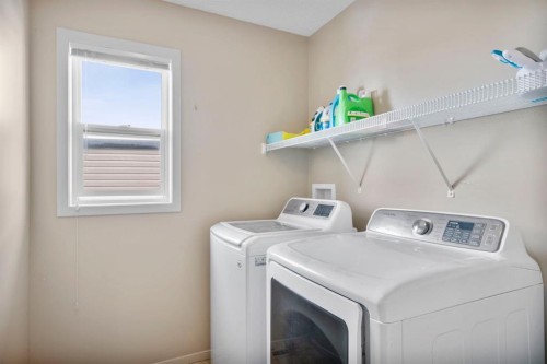 46 River Heights Boulevard, Cochrane, AB - Indoor Photo Showing Laundry Room