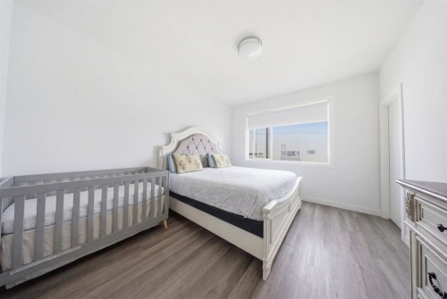 505-101 Panatella Square Nw, Calgary, AB - Indoor Photo Showing Bedroom