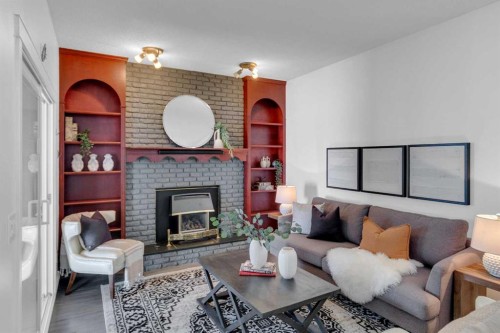 11 Woodfield Crescent Sw, Calgary, AB - Indoor Photo Showing Living Room With Fireplace