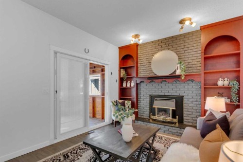 11 Woodfield Crescent Sw, Calgary, AB - Indoor Photo Showing Living Room With Fireplace