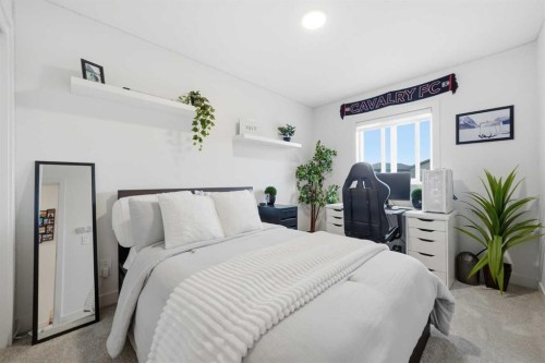 171 Wolf Creek Avenue Se, Calgary, AB - Indoor Photo Showing Bedroom