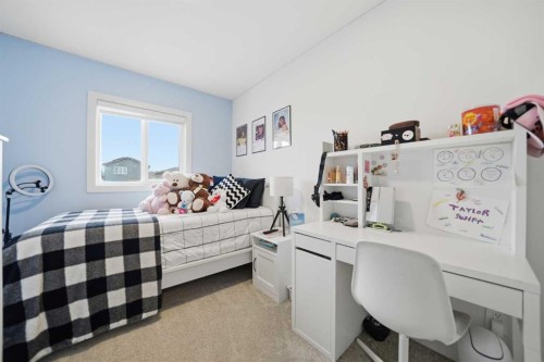 171 Wolf Creek Avenue Se, Calgary, AB - Indoor Photo Showing Bedroom