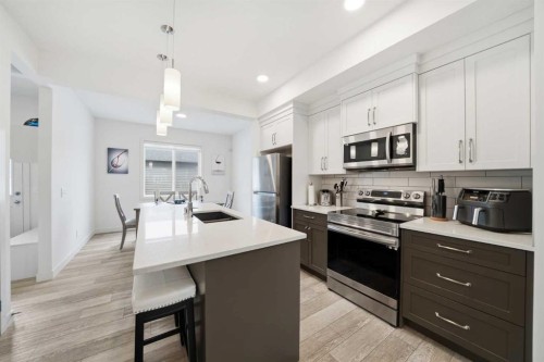 171 Wolf Creek Avenue Se, Calgary, AB - Indoor Photo Showing Kitchen With Upgraded Kitchen
