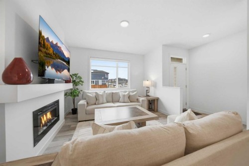 171 Wolf Creek Avenue Se, Calgary, AB - Indoor Photo Showing Living Room With Fireplace