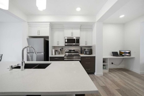 171 Wolf Creek Avenue Se, Calgary, AB - Indoor Photo Showing Kitchen With Double Sink