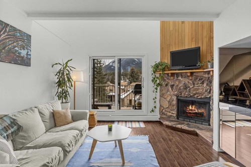 214-200 Three Sisters Drive, Canmore, AB - Indoor Photo Showing Living Room With Fireplace