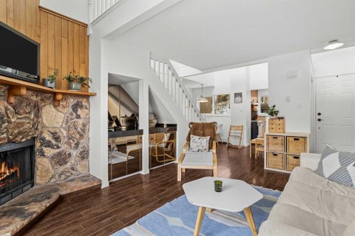 214-200 Three Sisters Drive, Canmore, AB - Indoor Photo Showing Living Room With Fireplace