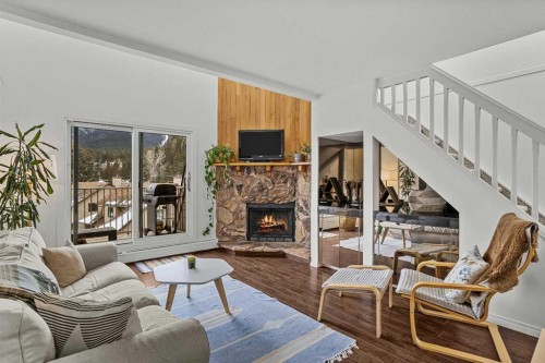214-200 Three Sisters Drive, Canmore, AB - Indoor Photo Showing Living Room With Fireplace