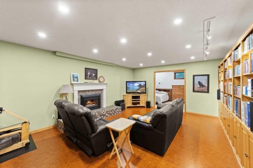 25 Westheights Drive, Didsbury, AB - Indoor Photo Showing Other Room With Fireplace