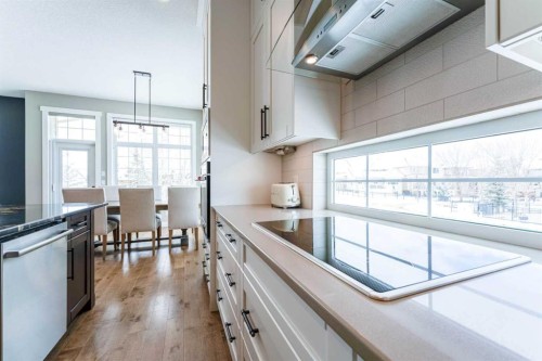 102 Coopersfield Way Sw, Airdrie, AB - Indoor Photo Showing Kitchen With Upgraded Kitchen