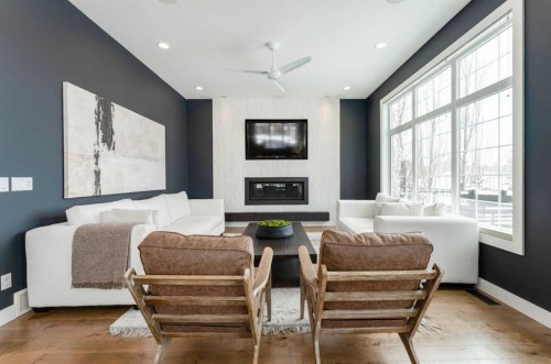 102 Coopersfield Way Sw, Airdrie, AB - Indoor Photo Showing Living Room With Fireplace