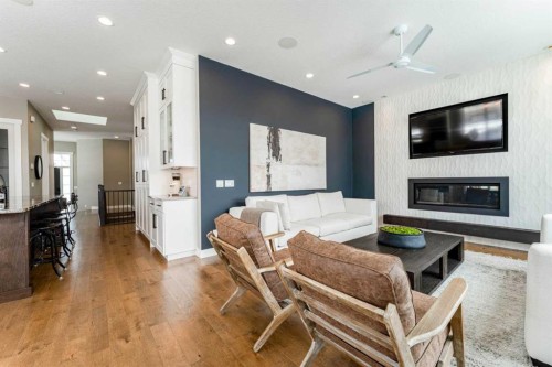 102 Coopersfield Way Sw, Airdrie, AB - Indoor Photo Showing Living Room With Fireplace