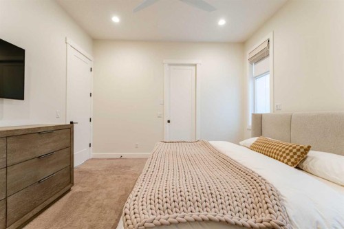 102 Coopersfield Way Sw, Airdrie, AB - Indoor Photo Showing Bedroom