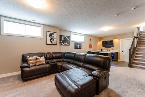 102 Coopersfield Way Sw, Airdrie, AB - Indoor Photo Showing Living Room